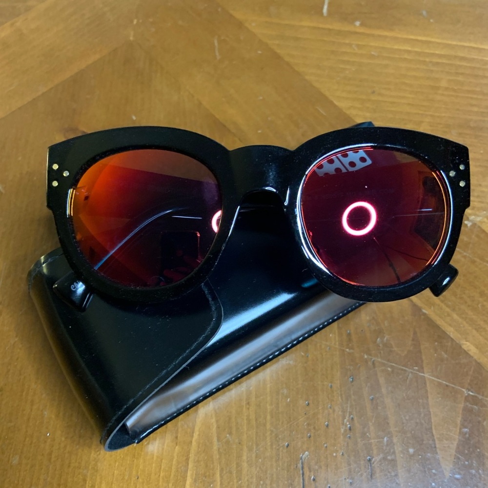 Foster Grant — women’s red-tinted sunglasses. Never worn. With case.